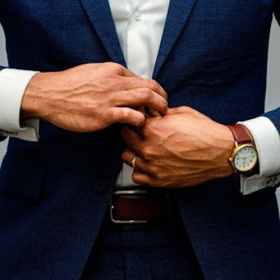 Man tying suit jacket