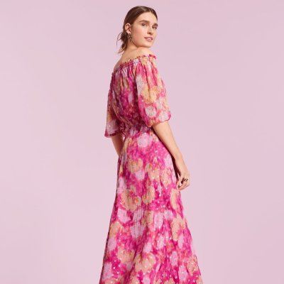 Womna wearing pink floral Loft dress.