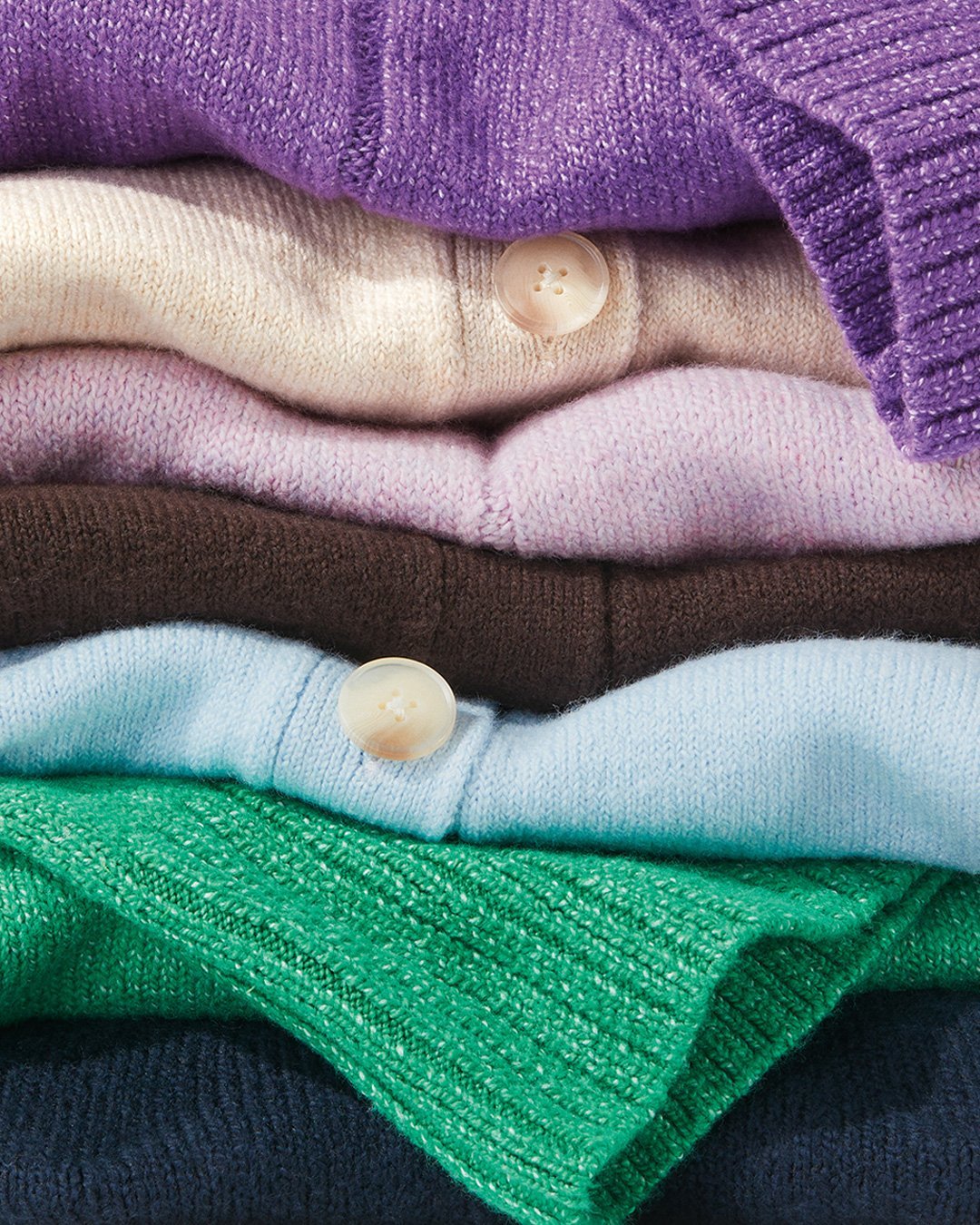 LOFT a stack of shirts and sweaters
