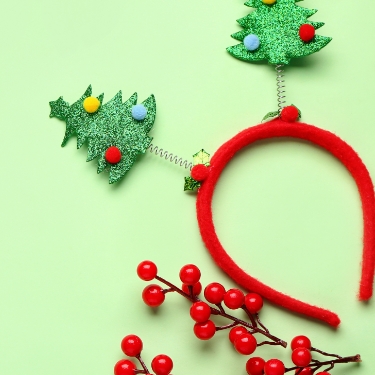 red headband with Christmas trees on it